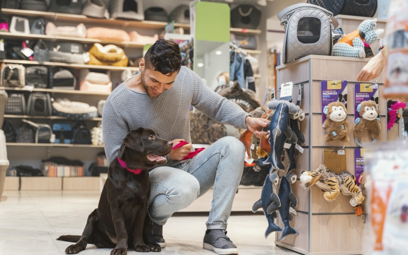 cute-dog-with-owner-pet-shop
